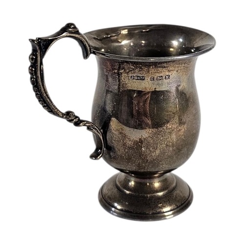 20 - AN EARLY 20TH CENTURY SILVER CHRISTENING JUG
Plain form with engraved initials, hallmarked Birmingha... 