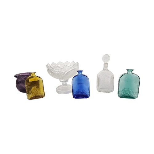 21 - A COLLECTION OF VINTAGE COLOURED GLASS
Comprising three scent bottles with embossed decoration, a pu... 