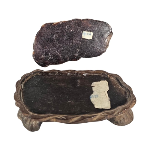 22 - AN EARLY 20TH CENTURY CHINESE CARVED SOAPSTONE GROUP OF A SOW AND PIGLETS
The mottled honey coloured... 