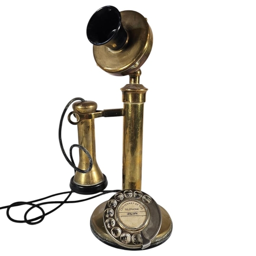 31 - A MID CENTURY BRASS 'CANDLESTICK' TELEPHONE
Marked to the dial ‘Centenary of the Telephone 1876 - 19... 