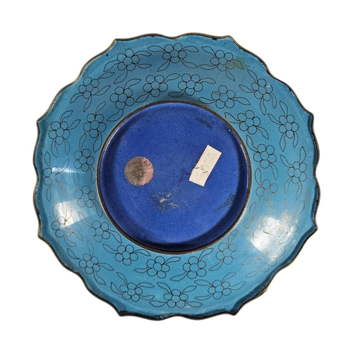 40 - A VINTAGE CLOISONNÉ CHARGER PLATE AND HARDWOOD STAND
Scalloped edge with floral decoration, on a pie... 
