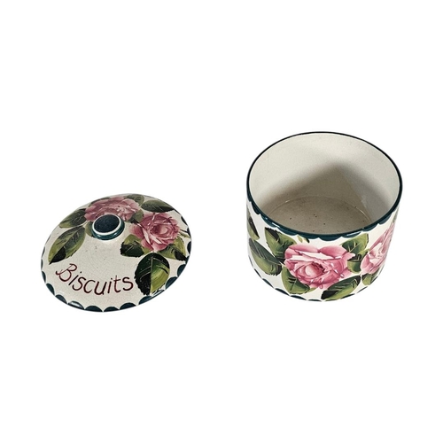 43 - WEMYSS WARE, AN EARLY 20TH CENTURY ‘CABBAGE ROSE’ POTTERY BISCUIT BOX
Hand painted decoration of pin... 