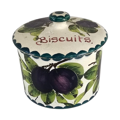 44 - WEMYSS WARE, AN EARLY 20TH CENTURY ‘PLUMS’ POTTERY BISCUIT BOX
Hand painted decoration of purple fru... 