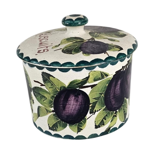 44 - WEMYSS WARE, AN EARLY 20TH CENTURY ‘PLUMS’ POTTERY BISCUIT BOX
Hand painted decoration of purple fru... 