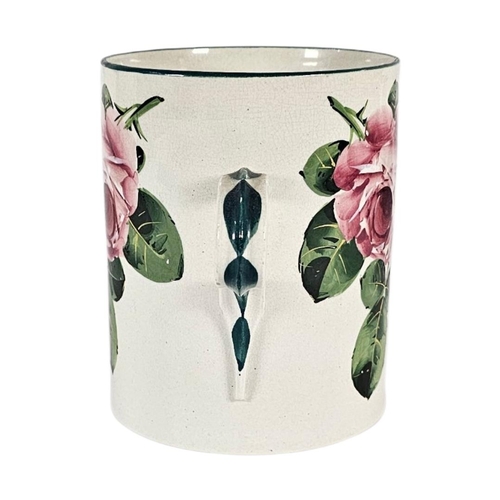 45 - A LARGE EARLY 20TH CENTURY WEMYSS ‘CABBAGE ROSE’ POTTERY LOVING CUP 
Twin handles with hand painted ... 