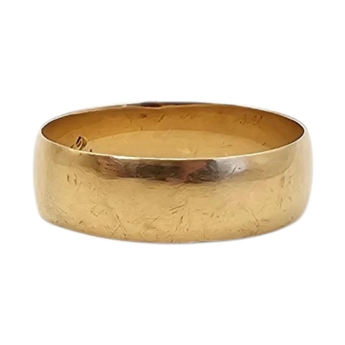 5 - A VINTAGE YELLOW METAL WIDE WEDDING RING
Bearing initials to interior, dated 1917.
(size X, approx 5... 