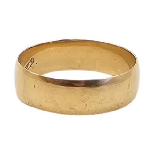 5 - A VINTAGE YELLOW METAL WIDE WEDDING RING
Bearing initials to interior, dated 1917.
(size X, approx 5... 
