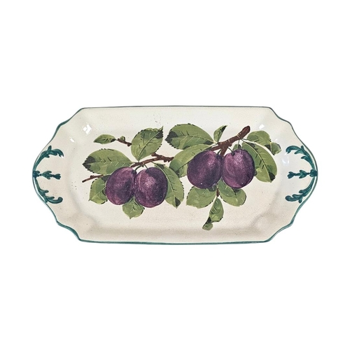 52 - WEMYSS WARE, AN EARLY 20TH CENTURY ‘PLUMS’ POTTERY SANDWICH TRAY’ 
Hand painted decoration of purple... 