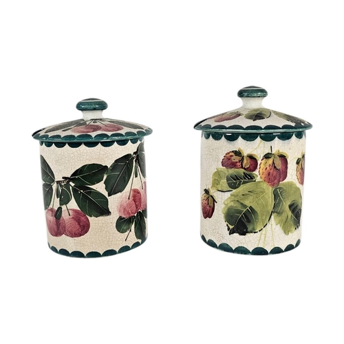 53 - WEMYSS WARE, TWO EARLY 20TH CENTURY ‘FRUIT‘ POTTERY PRESERVE POTS
Have painted decoration of strawbe... 