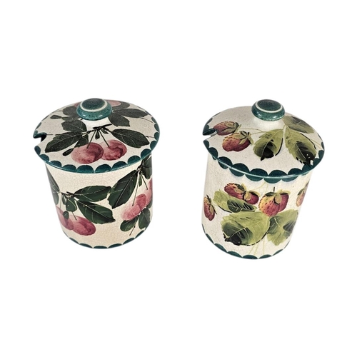 53 - WEMYSS WARE, TWO EARLY 20TH CENTURY ‘FRUIT‘ POTTERY PRESERVE POTS
Have painted decoration of strawbe... 
