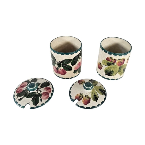 53 - WEMYSS WARE, TWO EARLY 20TH CENTURY ‘FRUIT‘ POTTERY PRESERVE POTS
Have painted decoration of strawbe... 