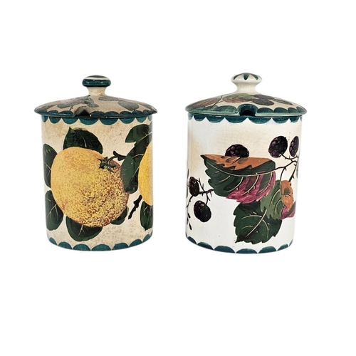 55 - WEMYSS WARE, TWO EARLY 20TH CENTURY ‘FRUIT‘ POTTERY PRESERVE POTS
Have painted decoration of strawbe... 