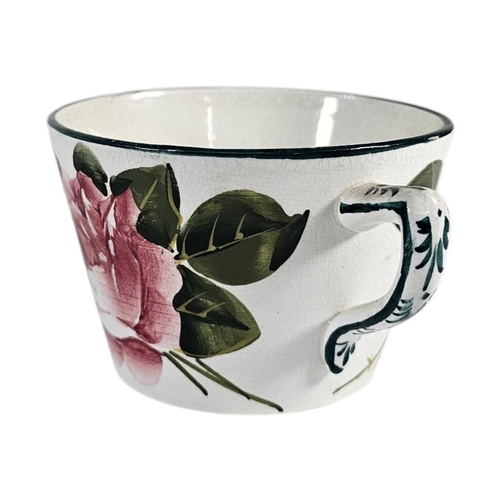 58 - WEMYSS WARE, AN EARLY 20TH CENTURY ‘CABBAGE ROSE ‘ POTTERY CUP AND SAUCER
Hand painted decoration wi... 