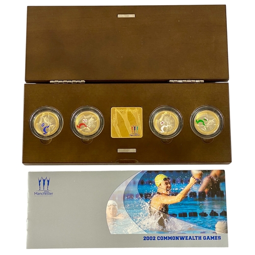 32 - 2002 Commonwealth Games 4-Coin Sterling Silver .925, Plated with Fine Gold and coloured.
Much as str... 