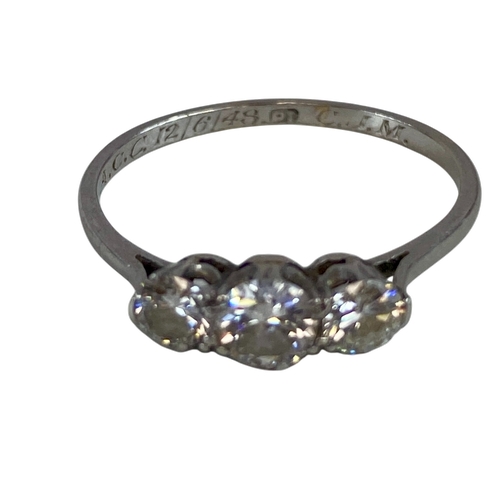 674 - Three Brilliant Cut Diamonds about 3.6 to 4.5mm Diameter set in a row of collets on a White Shank St... 