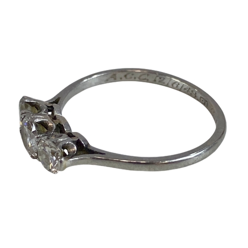 674 - Three Brilliant Cut Diamonds about 3.6 to 4.5mm Diameter set in a row of collets on a White Shank St... 