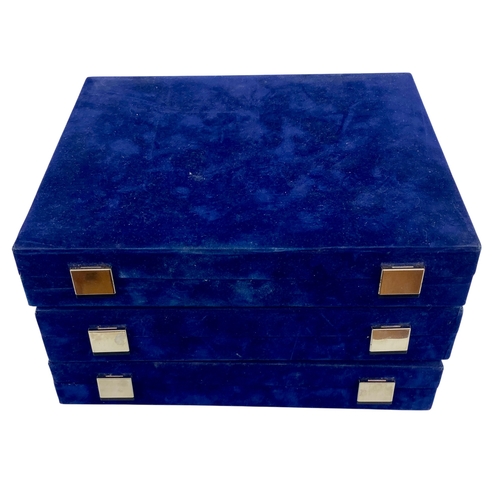 Three empty coin boxes.