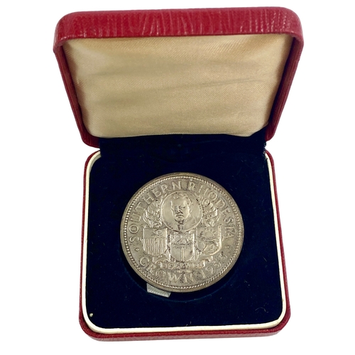 100 - Southern Rhodesia 1953 proof silver crown in crested case of issue.
Some toning, extremely fine or b... 