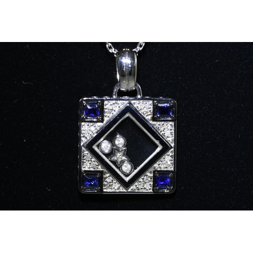 31 - 18 carat White Gold Sapphire & Diamond Pendant