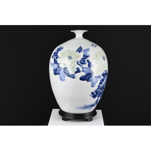 209 - Blue and White Floral Vase with wooden base