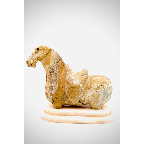 2 - A Chinese pottery figure of a horse. Possibly Han Period burial piece. Missing legs.