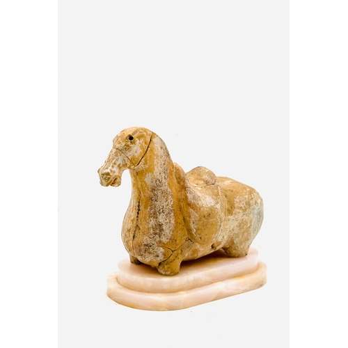 2 - A Chinese pottery figure of a horse. Possibly Han Period burial piece. Missing legs.