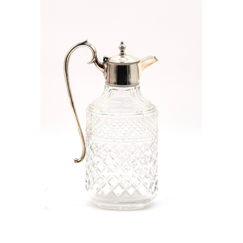 65 - Silver plated cut glass decanter with scroll handle