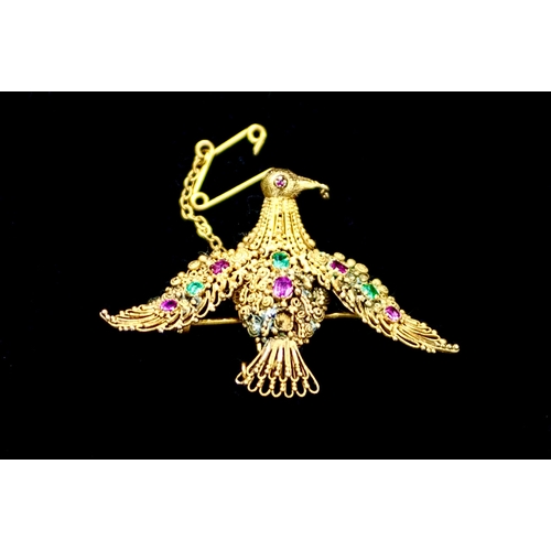 138 - A beautiful yellow metal Phoenix brooch testing for 18ct gold. Some damage and repairs also a missin... 