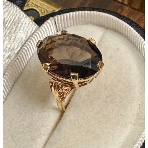 146 - A large smoky quartz ring in a 9ct yellow gold hallmarked mount.