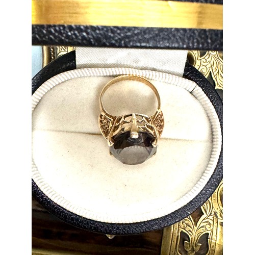 146 - A large smoky quartz ring in a 9ct yellow gold hallmarked mount.