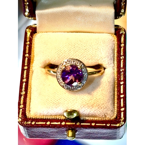 126 - Amethyst and Diamond 18ct Gold Ring.The quality and colour of the amethyst is good quality and a att... 