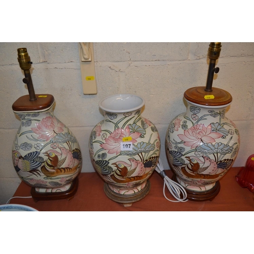 107 - PAIR OF POTTERY TABLE LAMPS DECORATED PHEASANTS AND MATCHING VASE