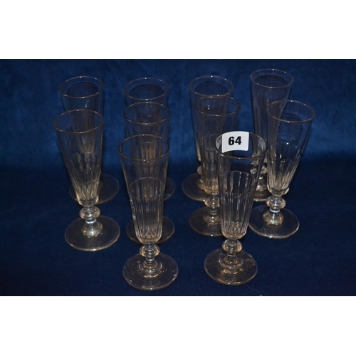 64 - NINE 19TH CENTURY GLASS CHAMPAGNE FLUTES WITH FLUTED BOWLS AND BALUSTER STEMS AND ONE SIMILAR (18cm)
