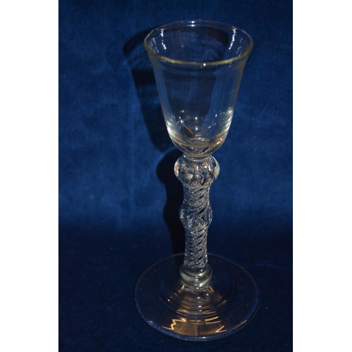 69 - 18TH CENTURY MULTI SPIRAL WINE GLASS WITH DOUBLE KNOP ON CIRCULAR FOOT (18cm)