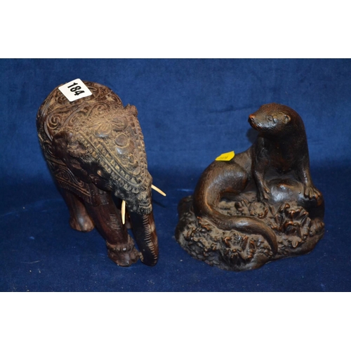 184 - CARVED WOOD AFRICAN ELEPHANT AND BRONZED RESIN OTTER