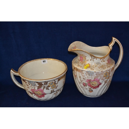 92 - 19TH CENTURY WEDGWOOD CREAM GILT AND FLOWERED TOILET JUG AND CHAMBER POT