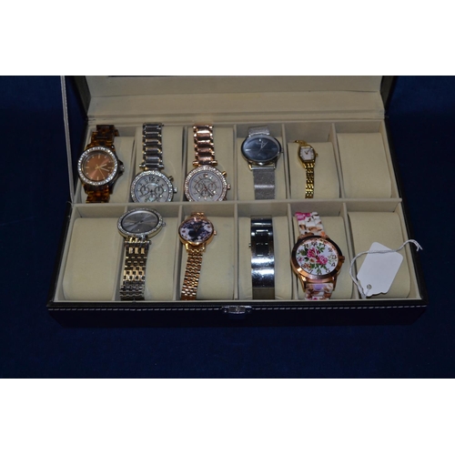 37 - DISPLAY CASE OF 9 WRISTWATCHES