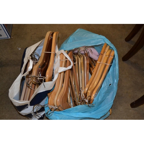 115 - LARGE QUANTITY OF WOODEN COAT HANGERS