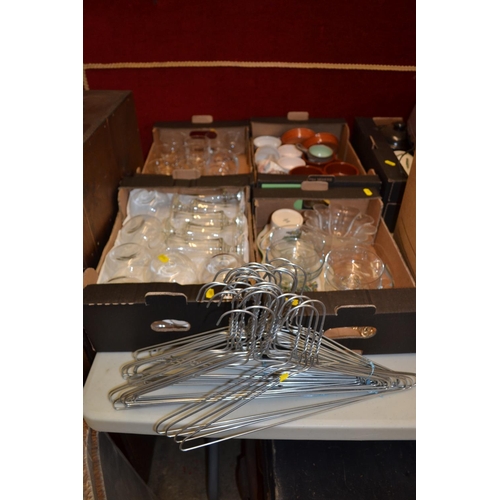 188 - 4 BOXES OF GLASSWARE AND COAT HANGERS