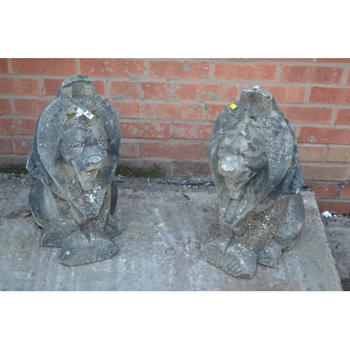 709 - PAIR OF ART DECO STONEWARE SITTING LIONS