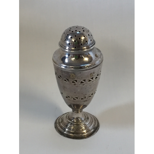 356 - SILVER PEPPERETTE WITH PIERCED DECORATION ON CIRCULAR STEPPED FOOT; LONDON 1804