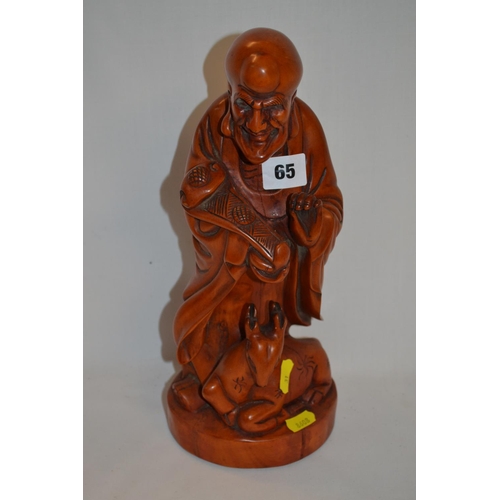 65 - CARVED WOOD ORIENTAL FIGURE