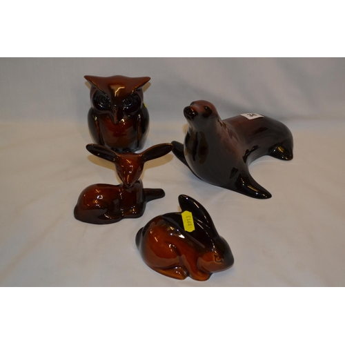 34 - FOUR VARIOUS BROWN GLAZED POTTERY ANIMALS