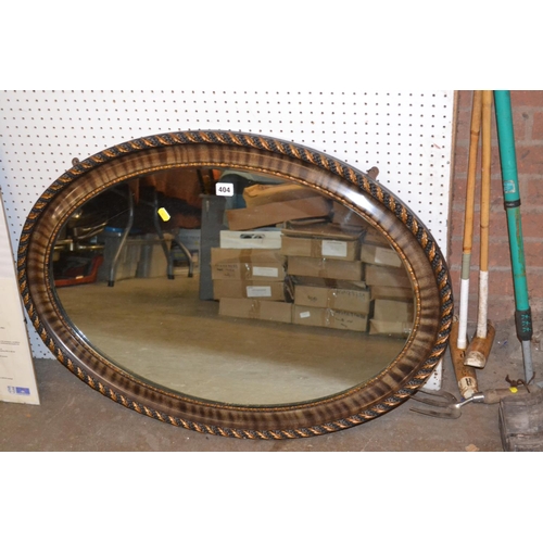 404 - OVAL WALL MIRROR IN CARVED LEAF FRAME