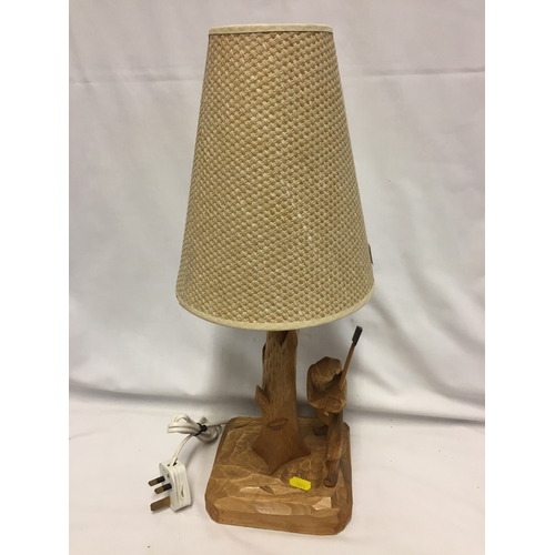 97 - CARVED WOODCUTTER TABLE LAMP AND SHADE