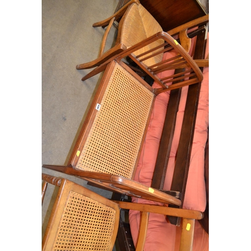 690 - LATE 19TH CENTURY MAHOGANY STOOL WITH CANE SEAT AND ARM SUPPORTS