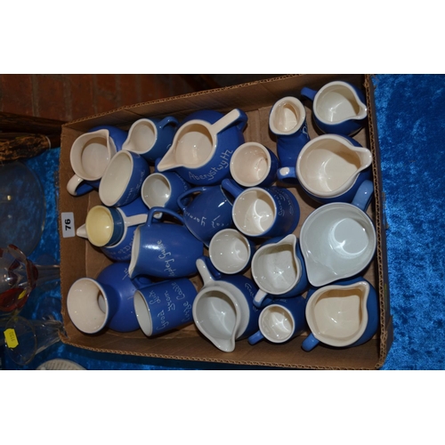 76 - 13 DEVONWARE BLUE CHINA JUGS, ETC.