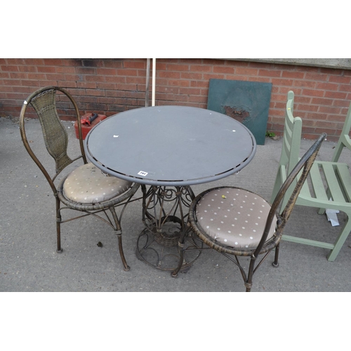 791 - CIRCULAR WROUGHT IRON PATIO TABLE AND 2 CHAIRS