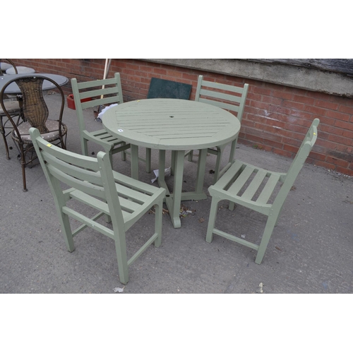 792 - CIRCULAR SLATTED WOOD TABLE AND 4 CHAIRS