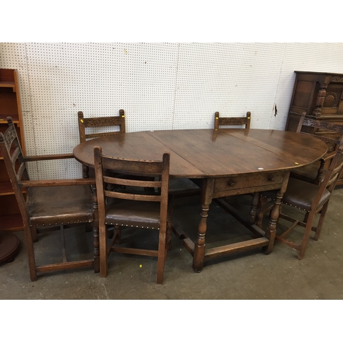 780 - REPRODUCTION CARVED OAK DINING SUITE COMPRISING GATE LEG DINING TABLE, 6 CHAIRS (4+2) AND COURT CUPB... 